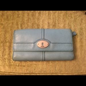 Fossil tri-fold wallet with snap button closure